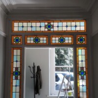 Bespoke stained glass windows around door frame Bespoke stained glass windows around door frame