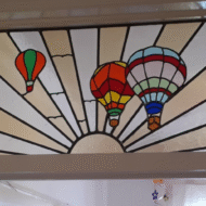 stained glass window with hot air balloon design